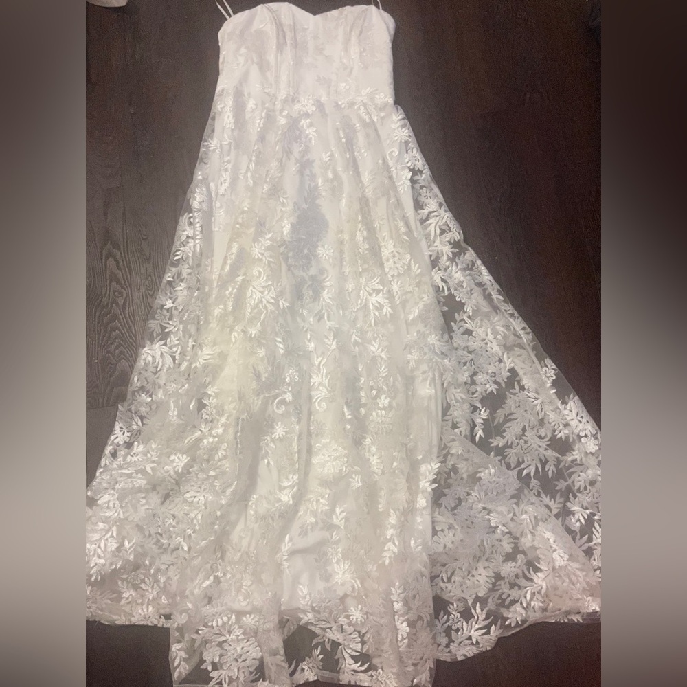 Worn once for my rehearsal dinner. White strapless bridal dress